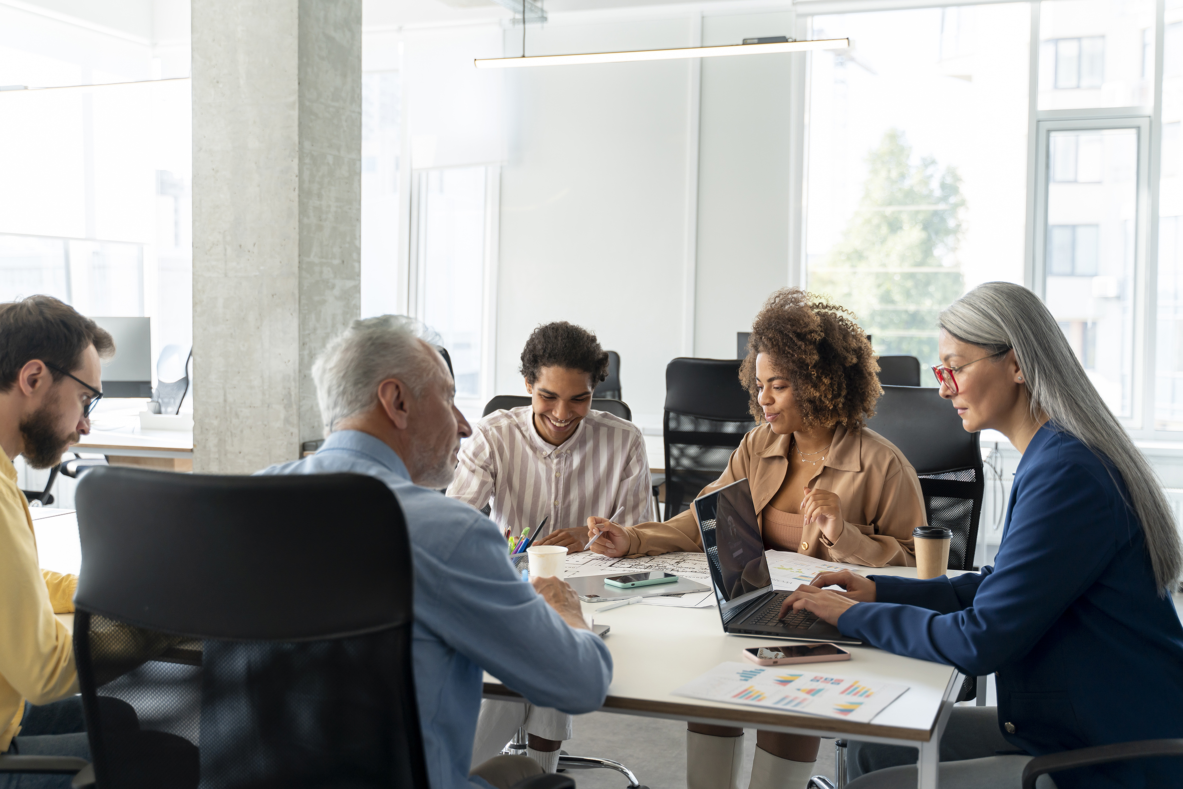 people sitting around a table working